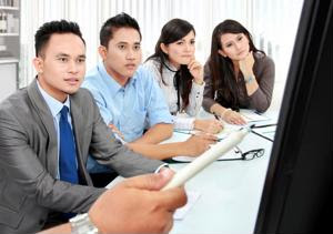 A group of employees watching a presentation.