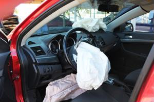 A car with its airbag depoyed.