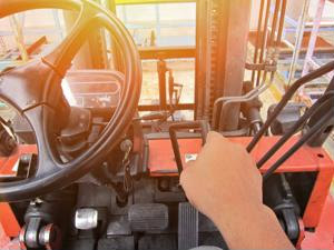 An employee uses a forklift.