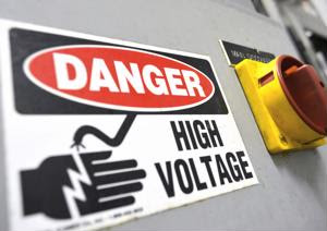 A "Danger: High Voltage" sign