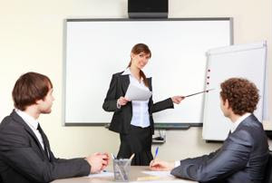 A businesswoman leads a meeting.