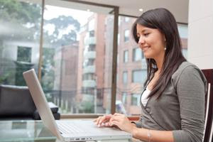 An employee works on a laptop.