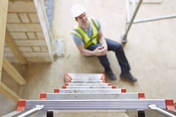 man looking up ladder